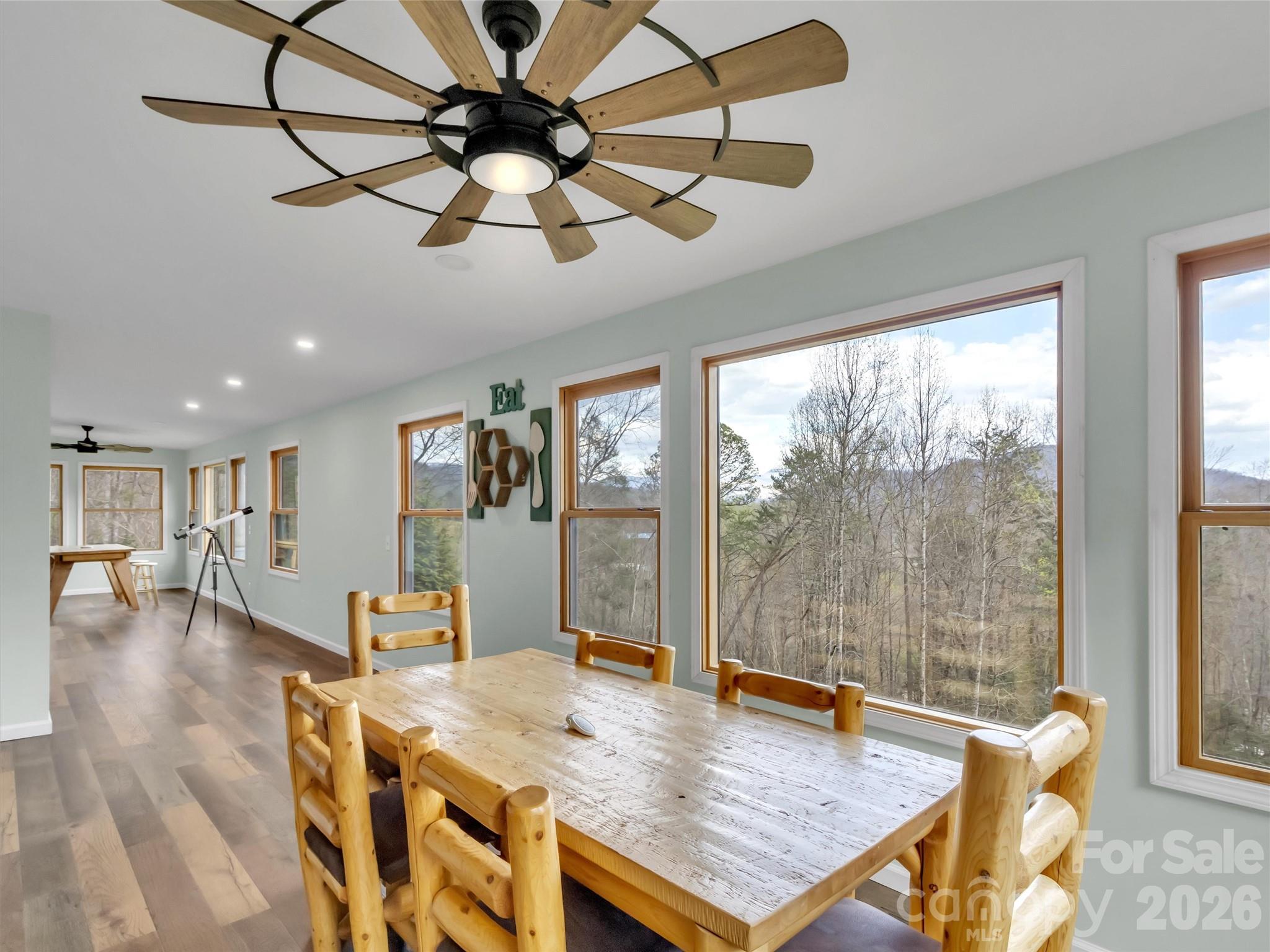 115 Fugitive Run Sylva, NC 28779 - Photo 14 of 47 a view of a dining room and livingroom with furniture wooden floor a chandelier