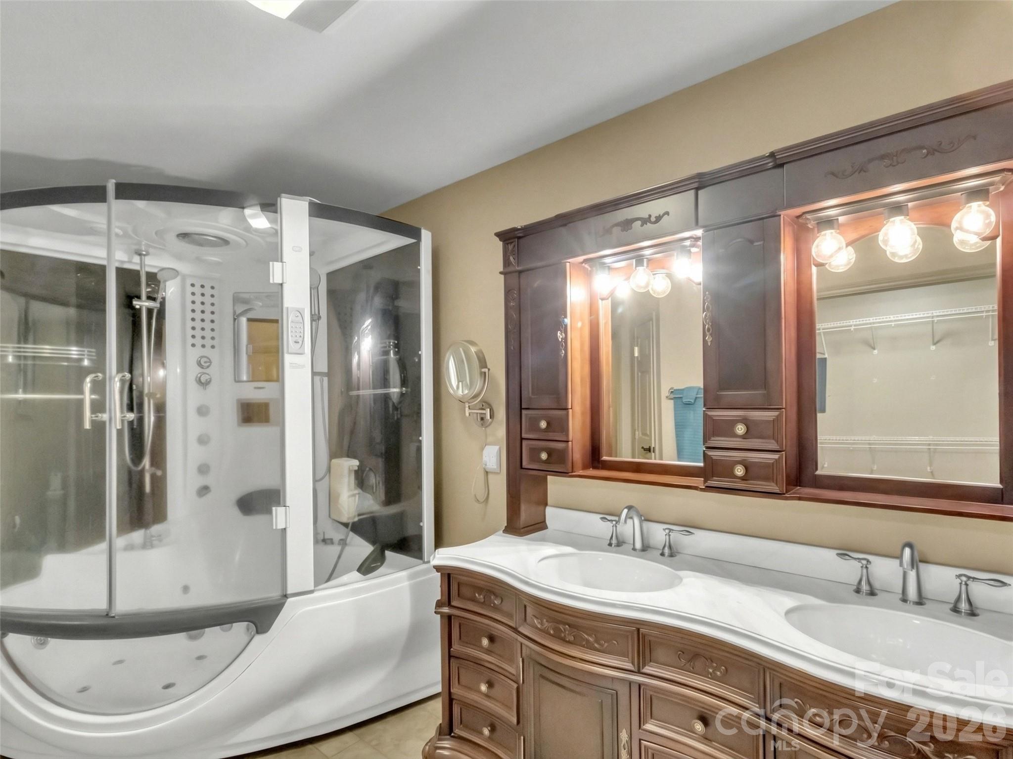 115 Fugitive Run Sylva, NC 28779 - Photo 18 of 47 a bathroom with a granite countertop sink and a mirror