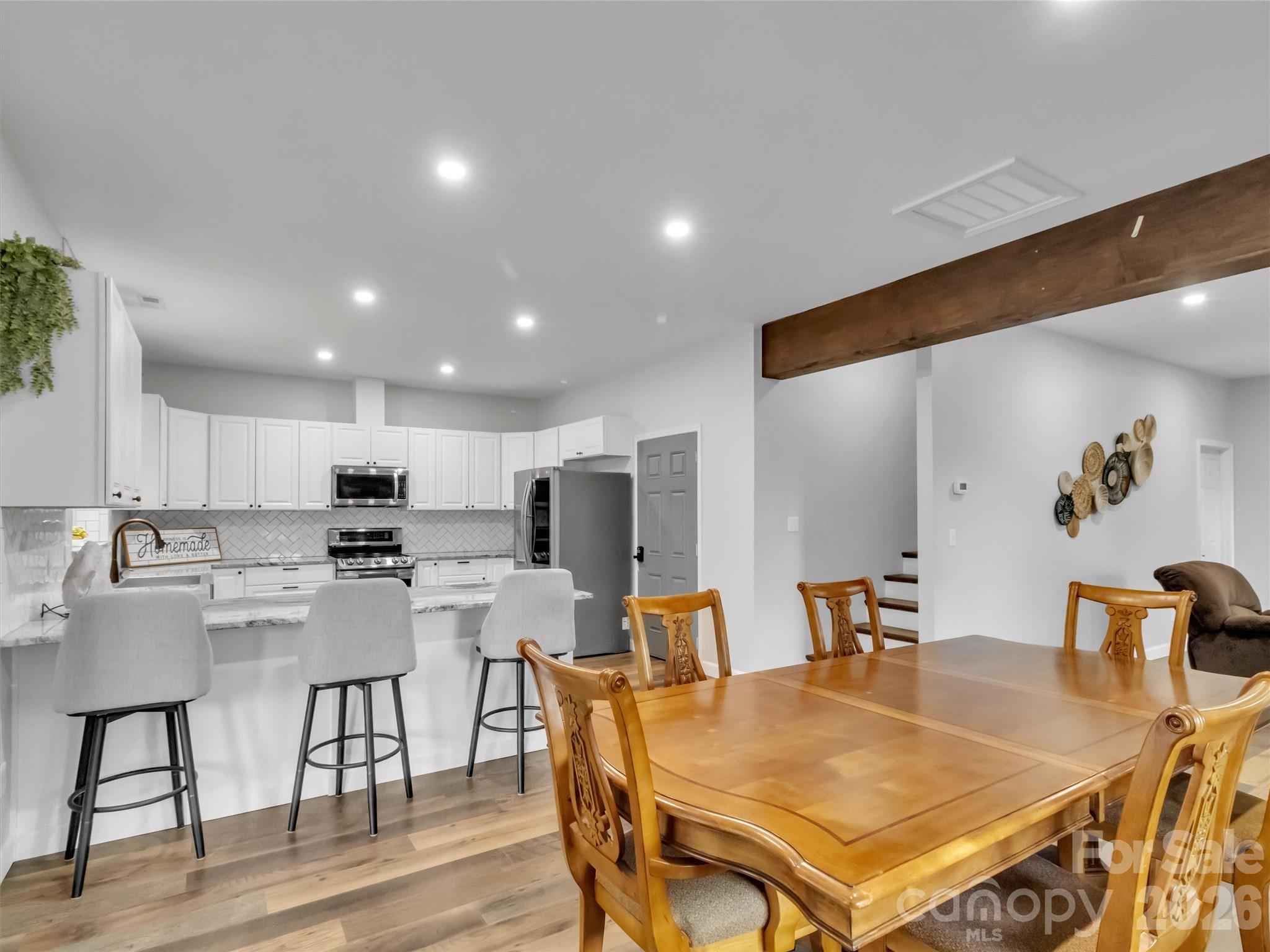 115 Fugitive Run Sylva, NC 28779 - Photo 27 of 47 a view of a dining room with furniture and wooden floor