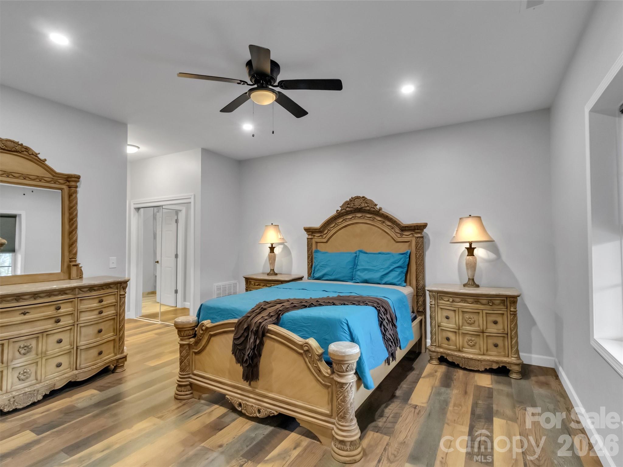 115 Fugitive Run Sylva, NC 28779 - Photo 30 of 47 a bedroom with a bed and a chandelier