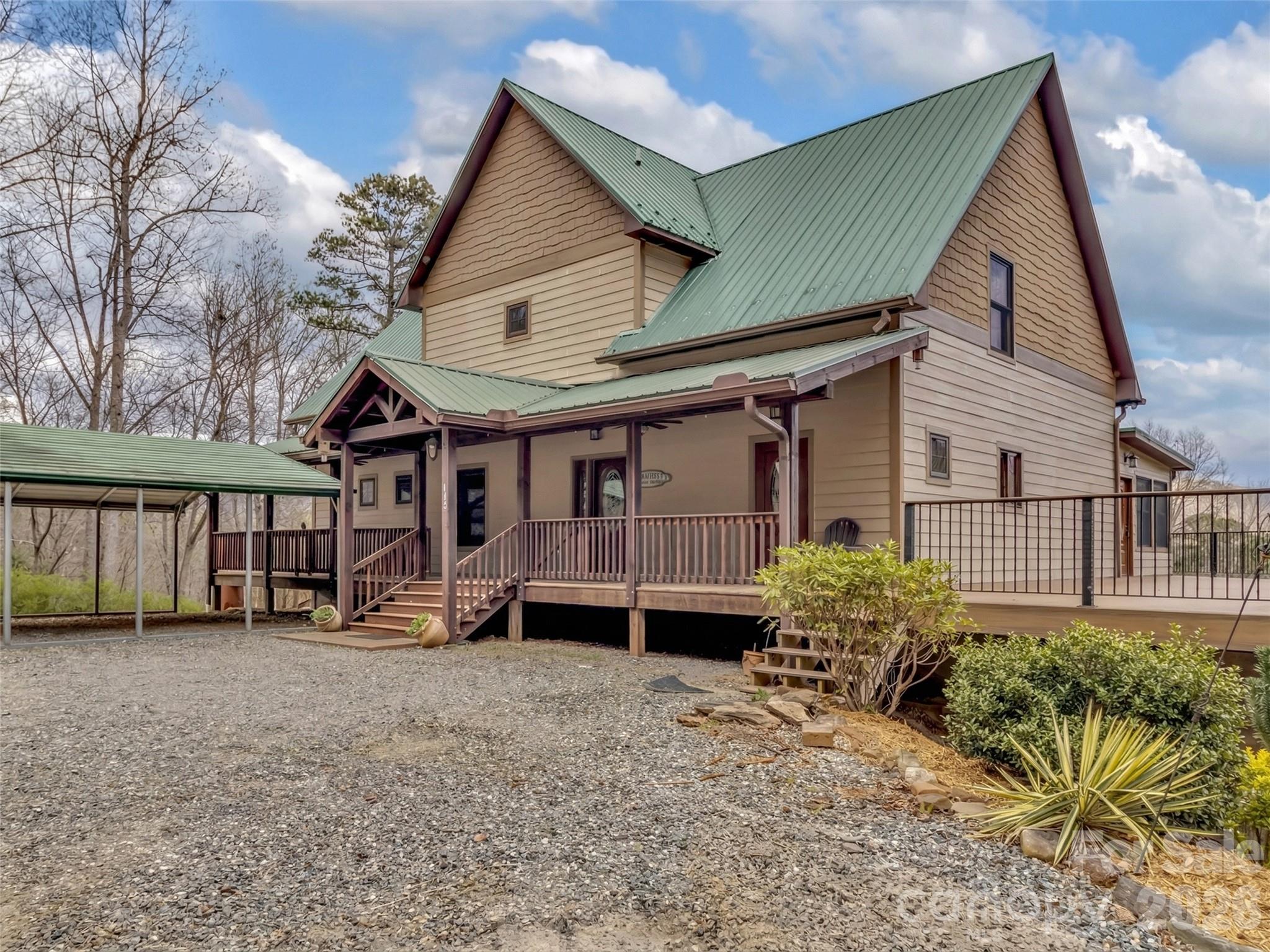 115 Fugitive Run Sylva, NC 28779 - Photo 39 of 47 a view of a house with a yard and sitting area