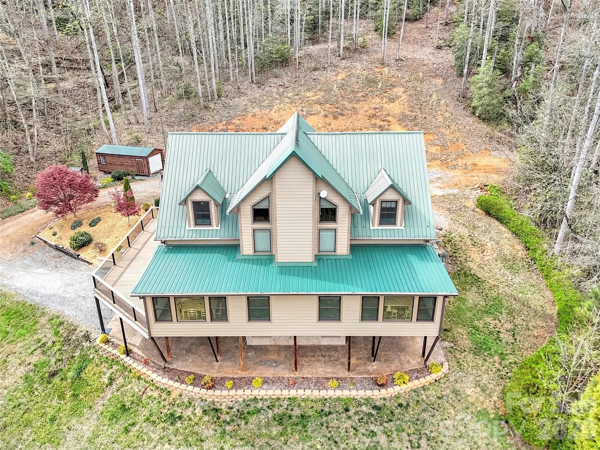 115 Fugitive Run Sylva, NC 28779 - Photo 45 of 47 a view of house with a swimming pool and sitting area