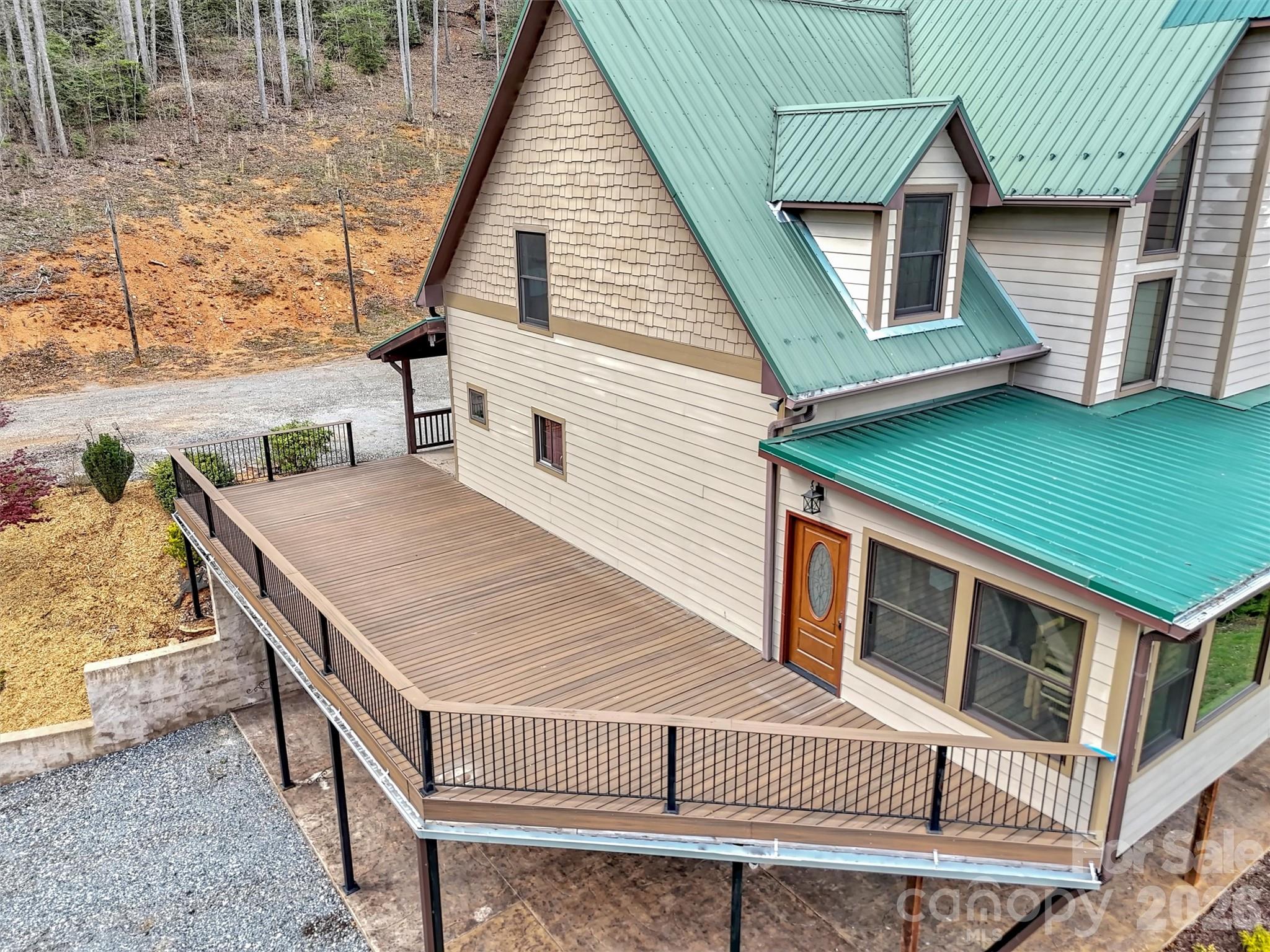 115 Fugitive Run Sylva, NC 28779 - Photo 5 of 47 a view of a house with backyard and deck