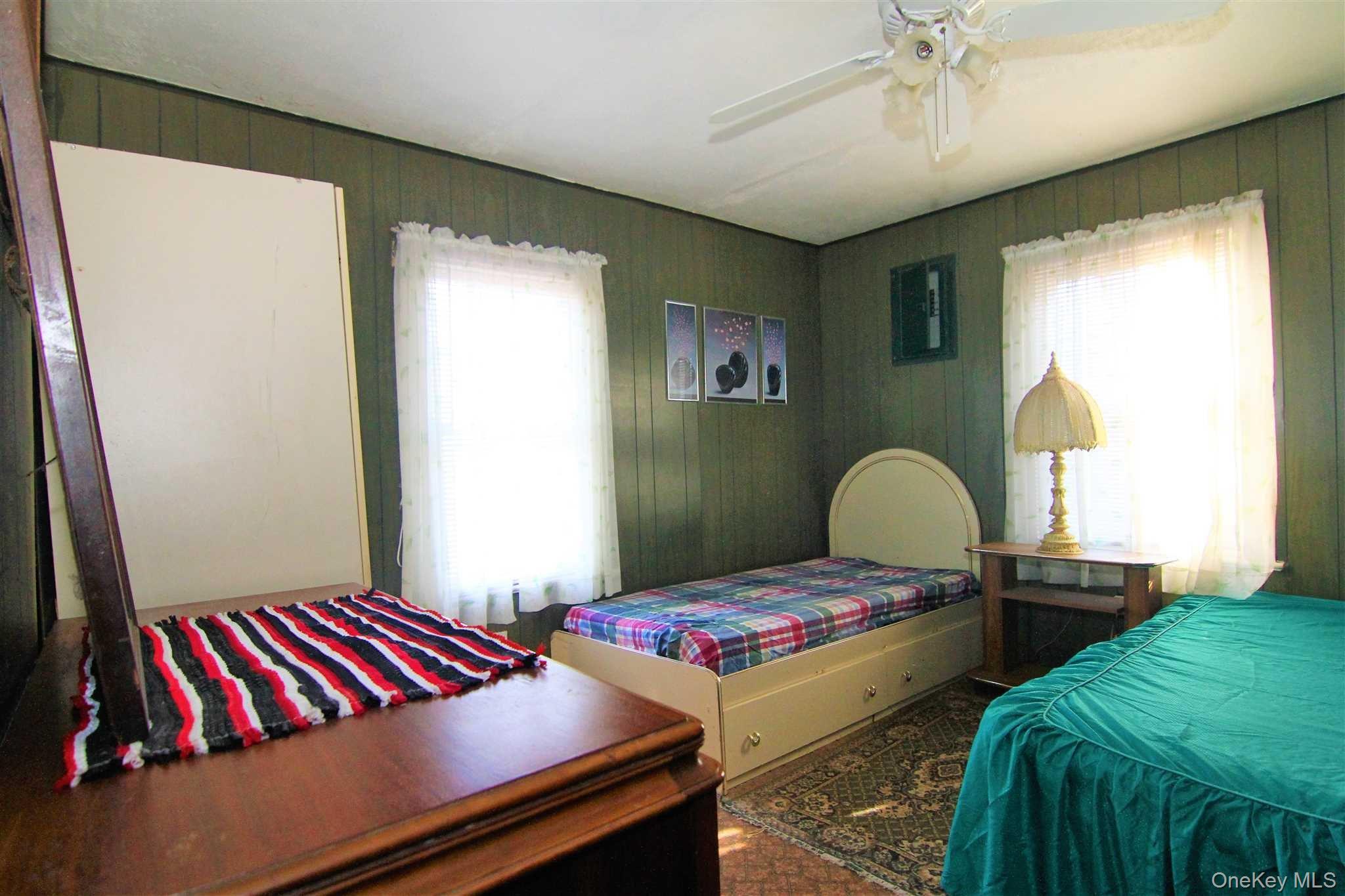 35 Glanhope Road, Unit 18 Hopewell Junction, NY 12533 - Photo 11 of 25 a bedroom with a bed and a chandelier