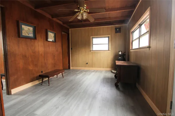 a view of room with a window and wooden floor