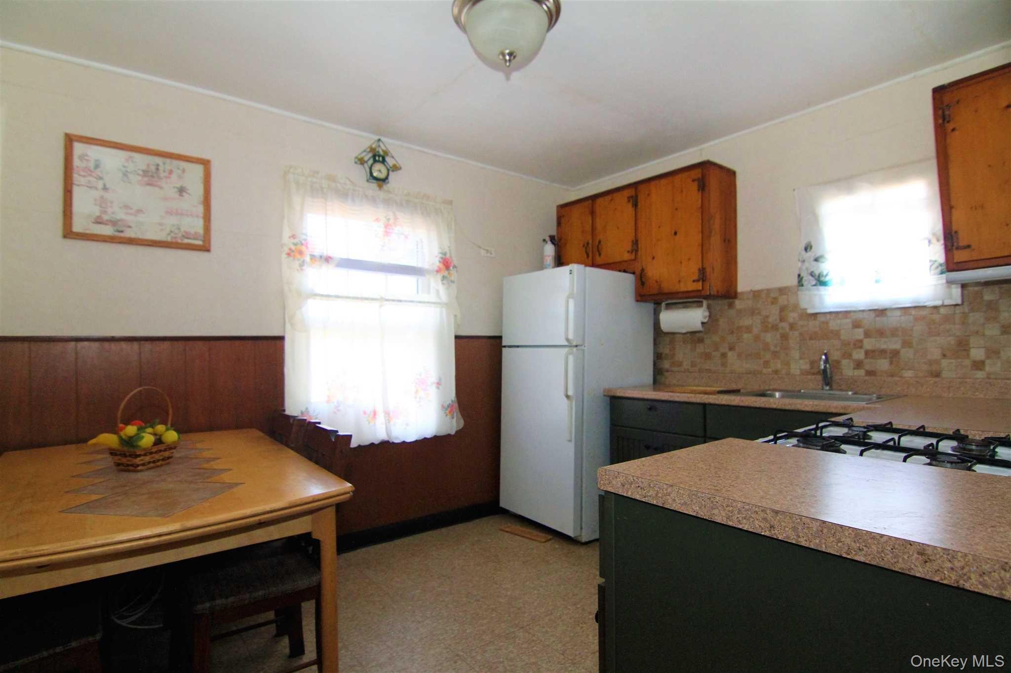 35 Glanhope Road, Unit 18 Hopewell Junction, NY 12533 - Photo 8 of 25 a kitchen with a refrigerator and a stove