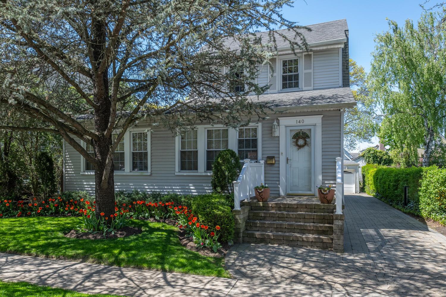 View of front of house featuring a shingled roof