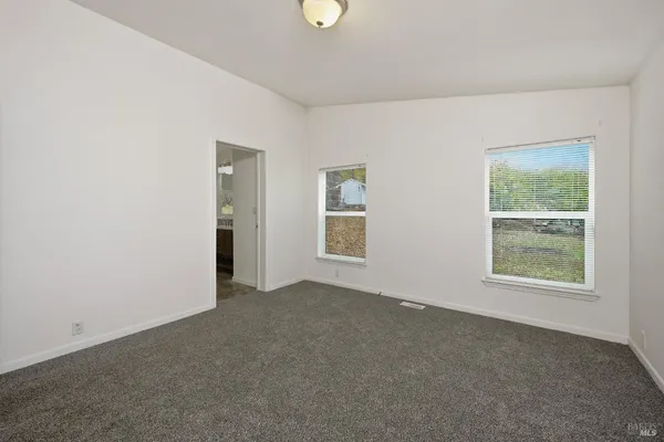 an empty room with windows