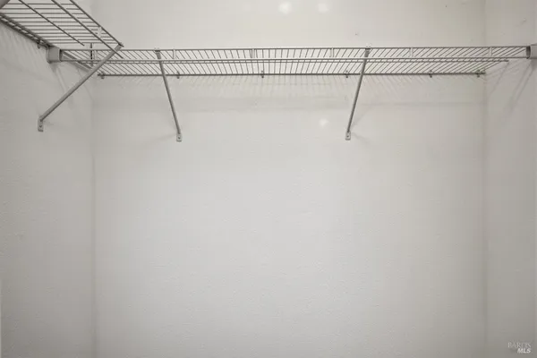 a view of a room with racks on the wall