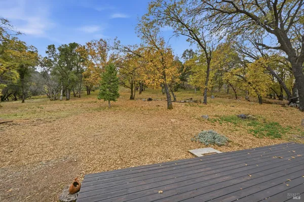 a view of empty space with wooden fence