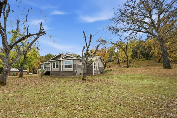 a view of a house with a yard