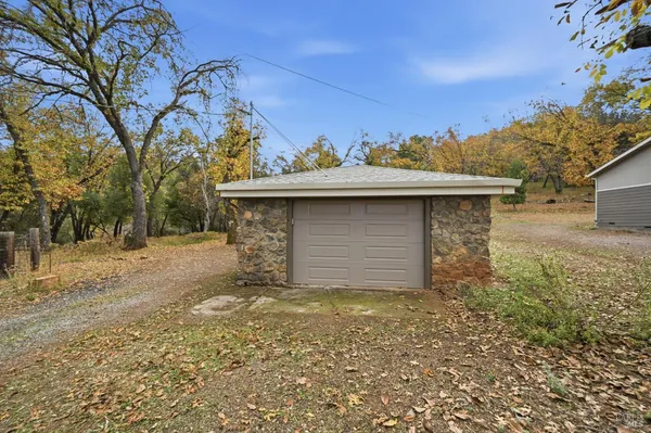 a view of a backyard of the house