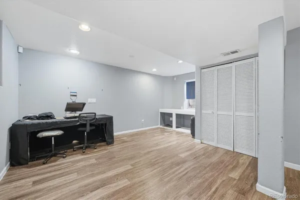 a room with a bed and a fireplace