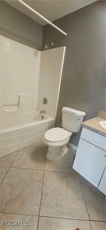 4722 30th Street Southwest Lehigh Acres, FL 33973 - Photo 8 of 12 a white toilet sitting next to a bath tub and a shower
