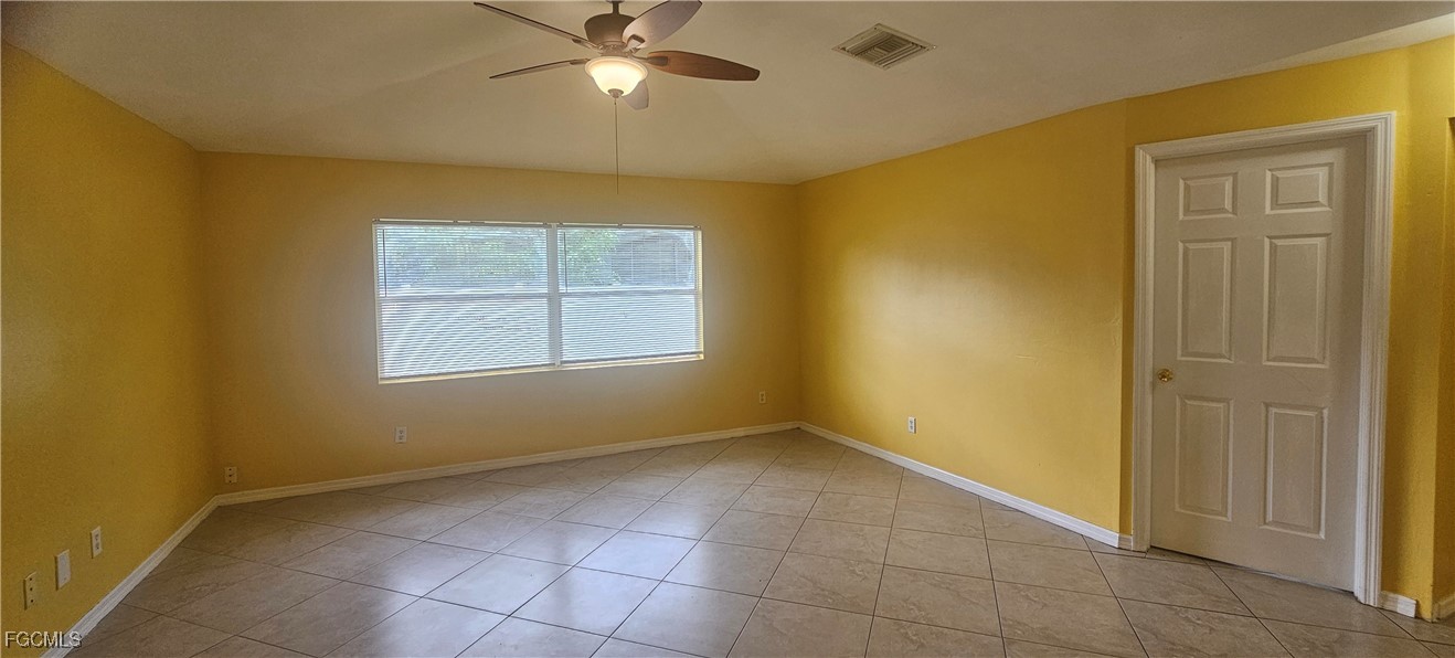 4722 30th Street Southwest Lehigh Acres, FL 33973 - Photo 10 of 12 a view of an empty room with a window