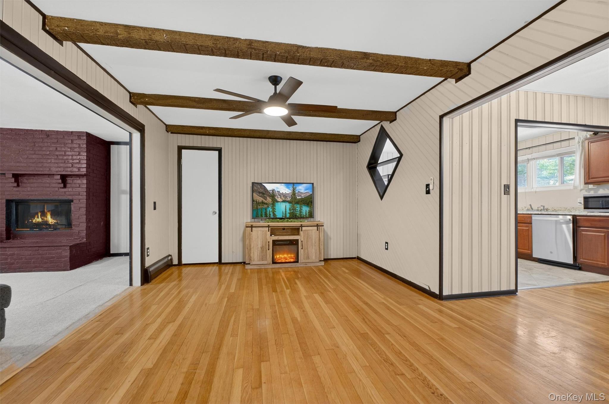 44 Legion Road Poughkeepsie, NY 12601 - Photo 15 of 28 a view of a hallway with wooden floor and a fireplace