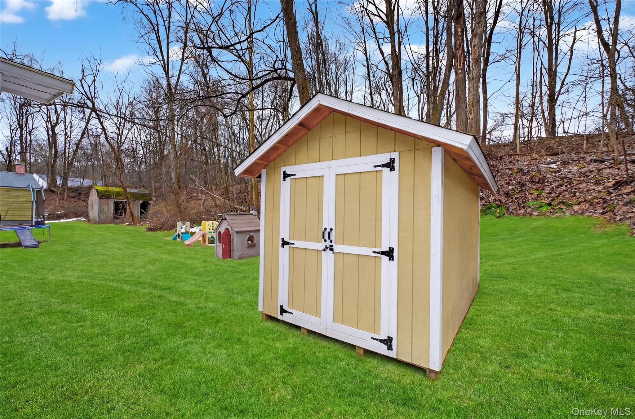 44 Legion Road Poughkeepsie, NY 12601 - Photo 26 of 28 a view of backyard with a garden and trees