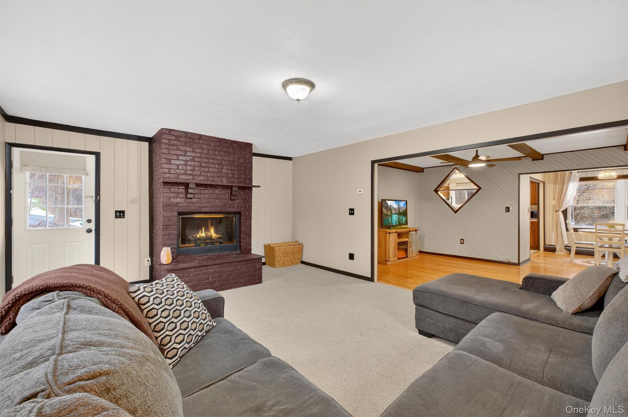44 Legion Road Poughkeepsie, NY 12601 - Photo 4 of 28 a living room with furniture and a fireplace