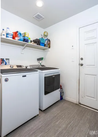 a utility room with washer and dryer