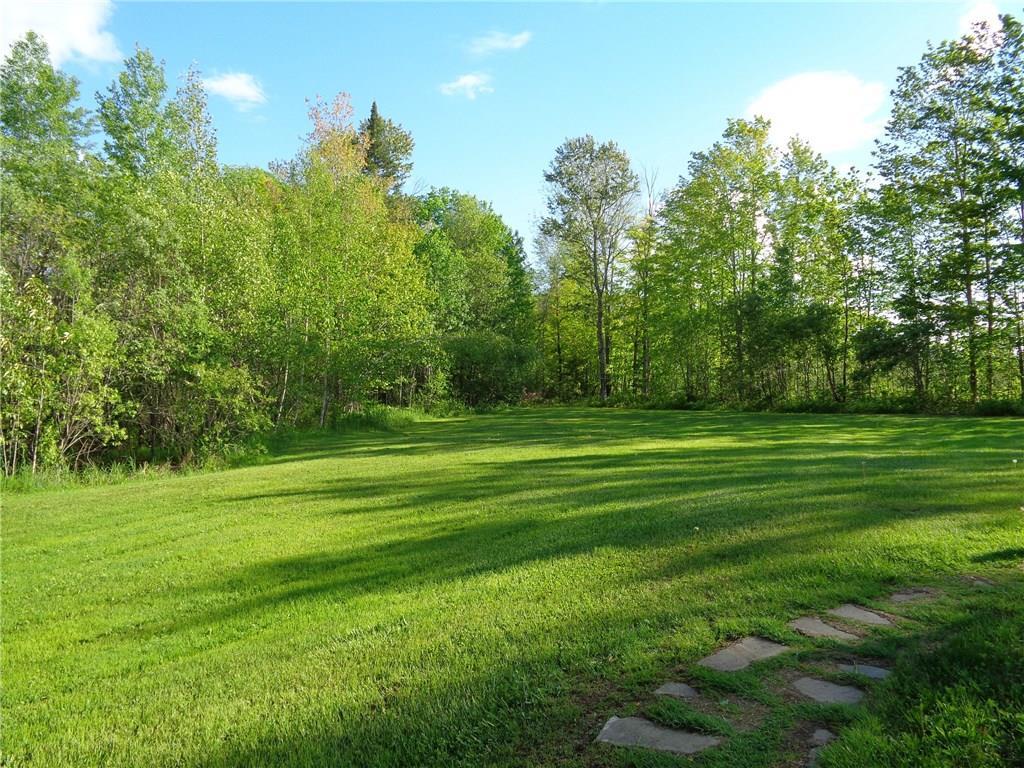 148 Line Road Corinna, ME 04928 - Photo 16 of 18 Nice back yard boarded by wood line.