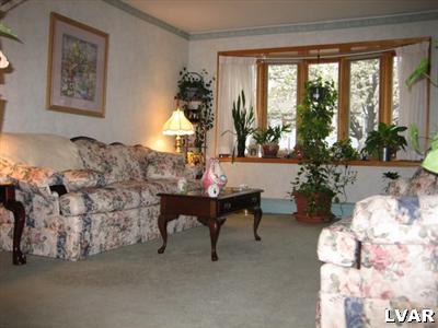 813 Spring Street Bethlehem, PA 18018 - Photo 8 of 12 a living room with furniture and a large window