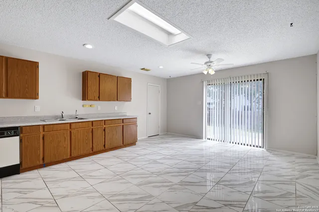 a large bathroom with a large mirror vanity and shower