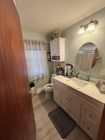 135 Bulat Drive Springfield, MA 01129 - Photo 5 of 19 a bathroom with a double vanity sink mirror and toilet