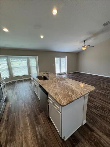 a kitchen with a stove and a sink