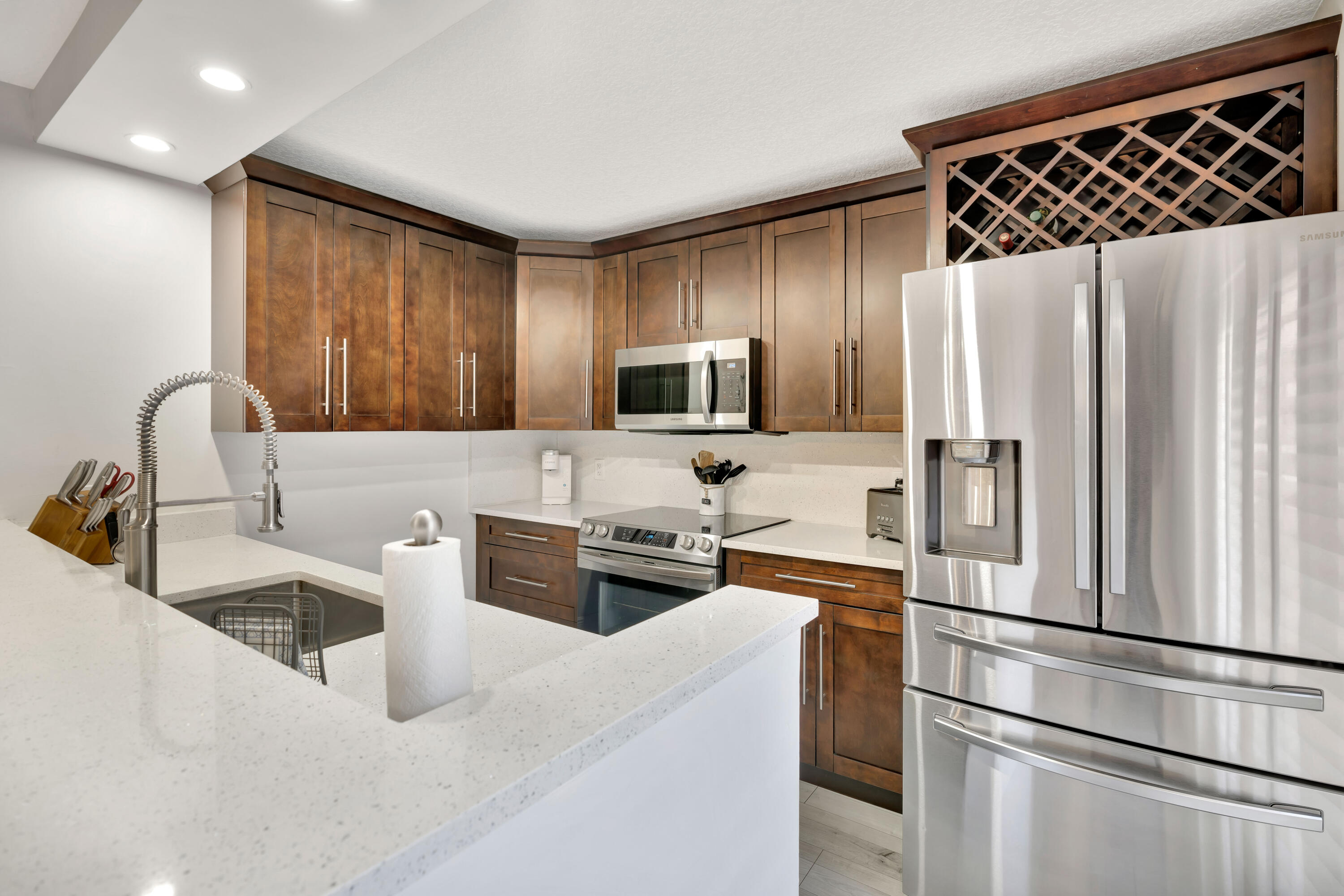1209 12th Court Jupiter, FL 33477 - Photo 13 of 31 a kitchen with stainless steel appliances a refrigerator sink and microwave