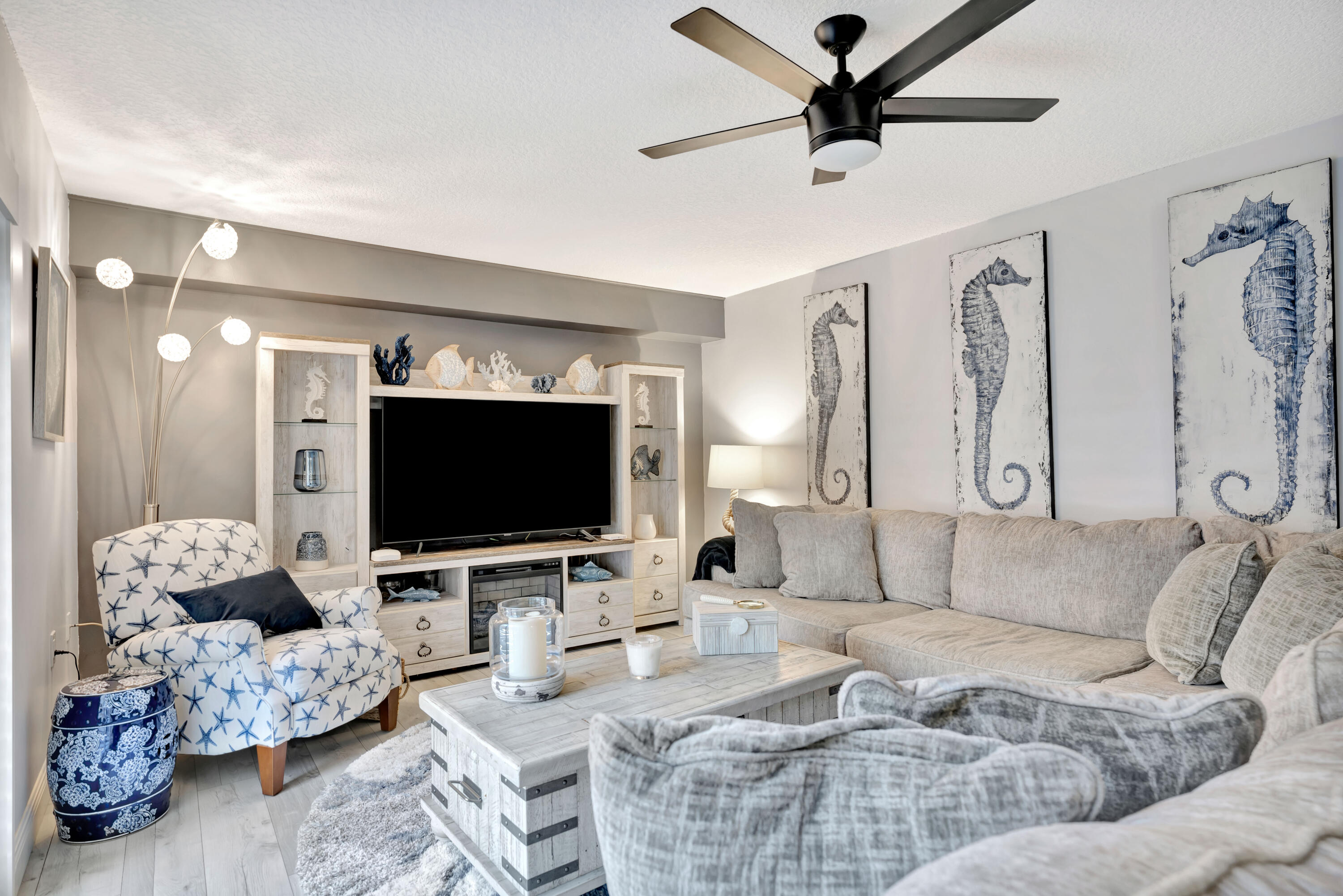 1209 12th Court Jupiter, FL 33477 - Photo 2 of 31 a living room with furniture and a flat screen tv