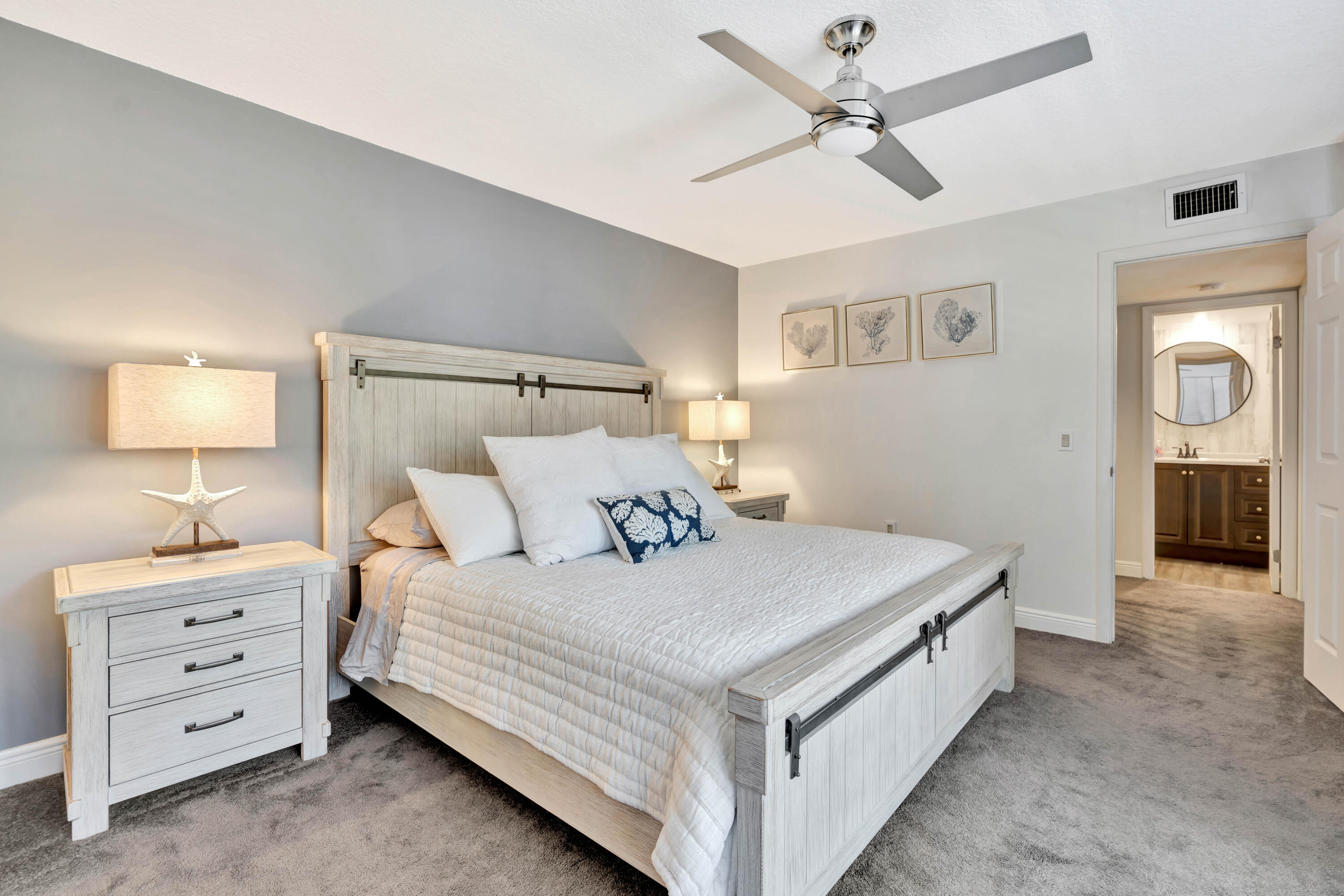 1209 12th Court Jupiter, FL 33477 - Photo 22 of 31 a bedroom with a bed and a night stand