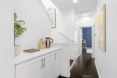 a kitchen with a sink and a refrigerator