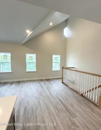 a view of an empty room and a window