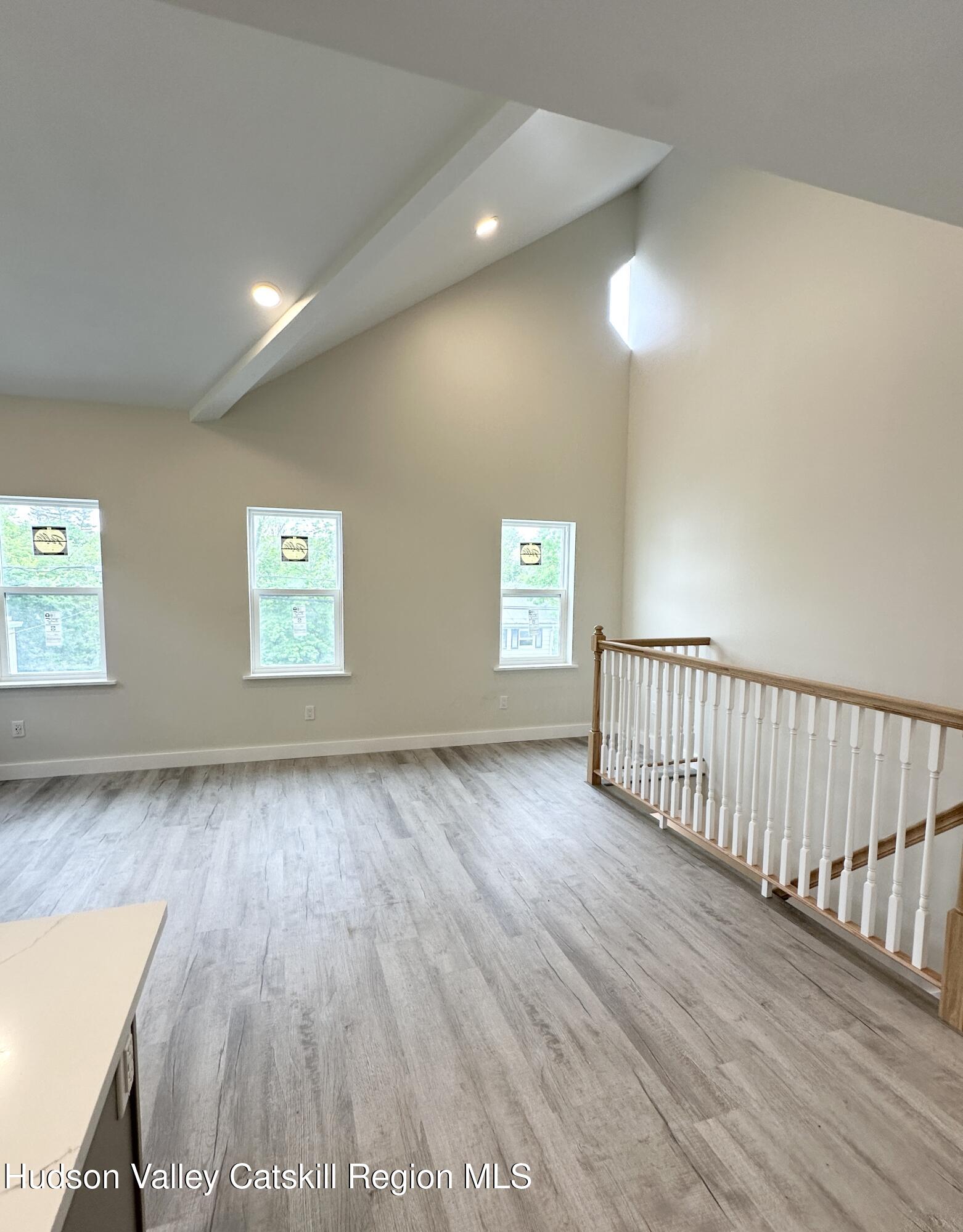 61 Thompson Street, Unit 4 Catskill, NY 12414 - Photo 2 of 6 a view of an empty room and a window