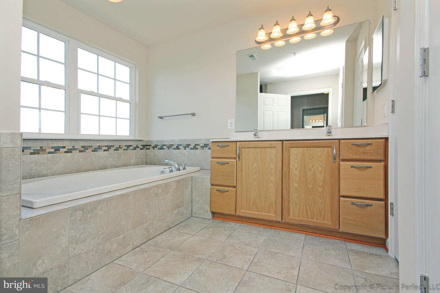 2001 Cassidy Court Point of Rocks, MD 21777 - Photo 22 of 30 a spacious bathroom with a tub sink and mirror