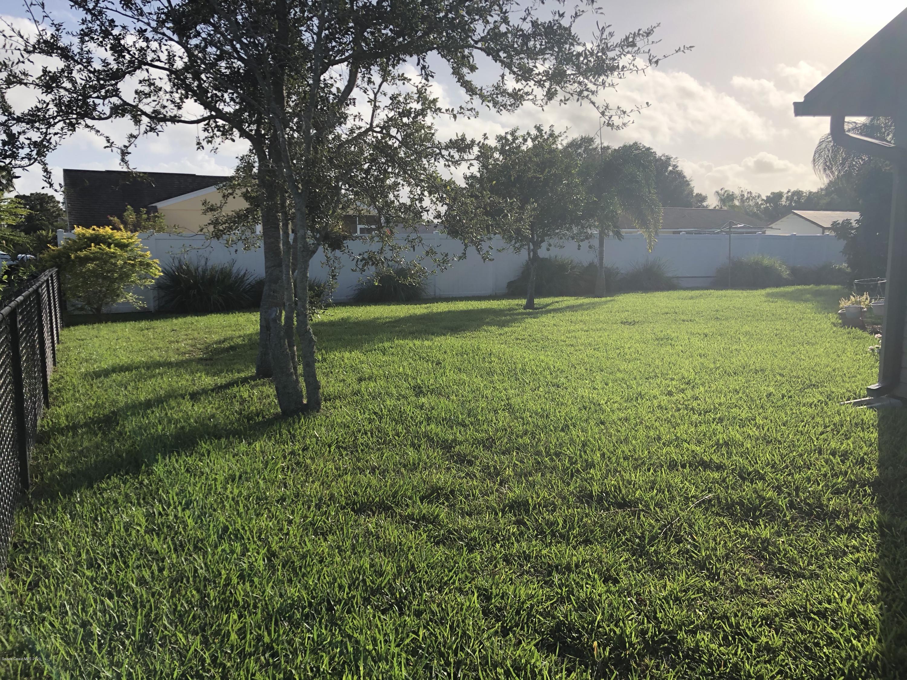1491 Creel Road Northeast Palm Bay, FL 32905 - Photo 10 of 50 a view of a yard