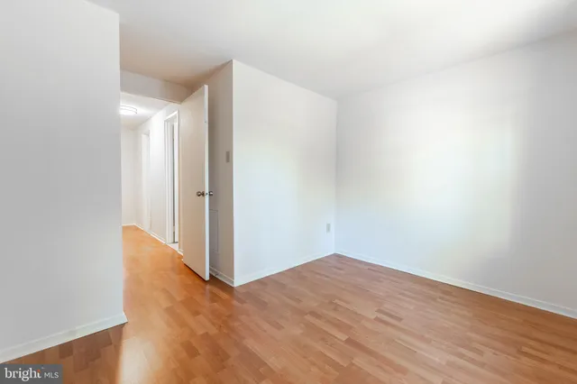 a view of hallway with wooden floor