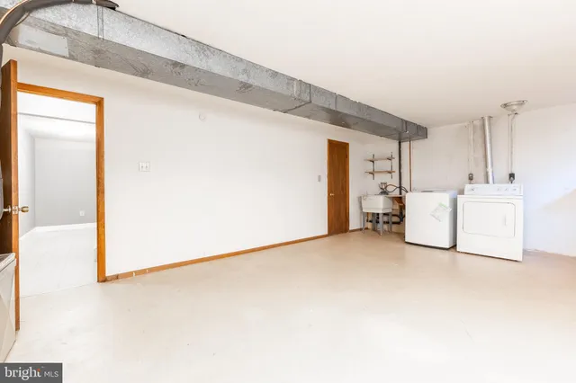 a view of a livingroom with a kitchen
