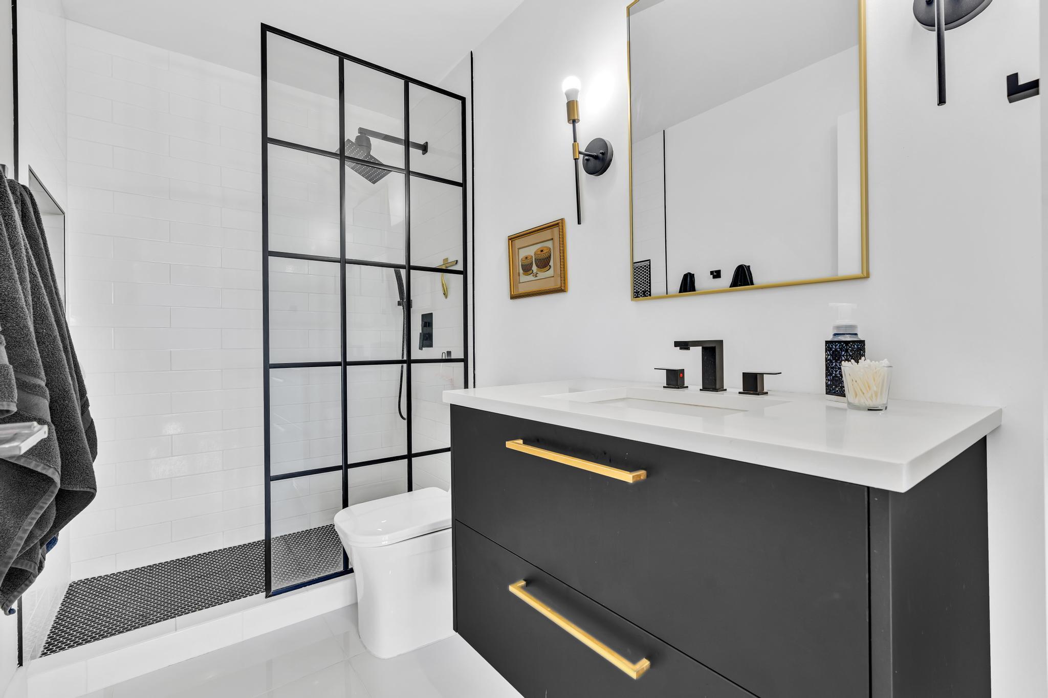 701 East Camino Real, Unit 12G Boca Raton, FL 33432 - Photo 33 of 82 a bathroom with a sink and a mirror