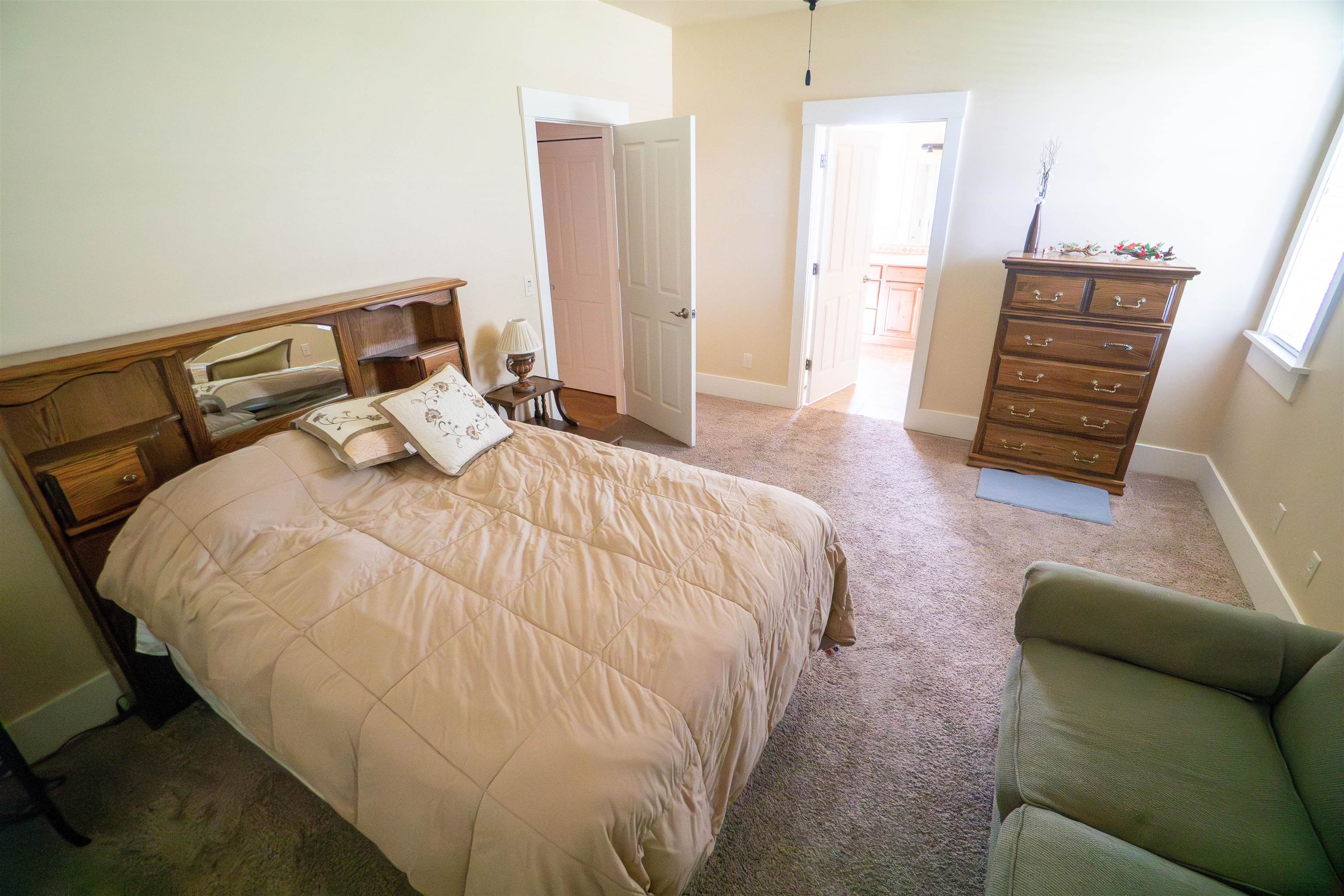 1111 Daisy Lane, Unit 32 Fruita, CO 81521 - Photo 12 of 23 a bedroom with a bed and a couch