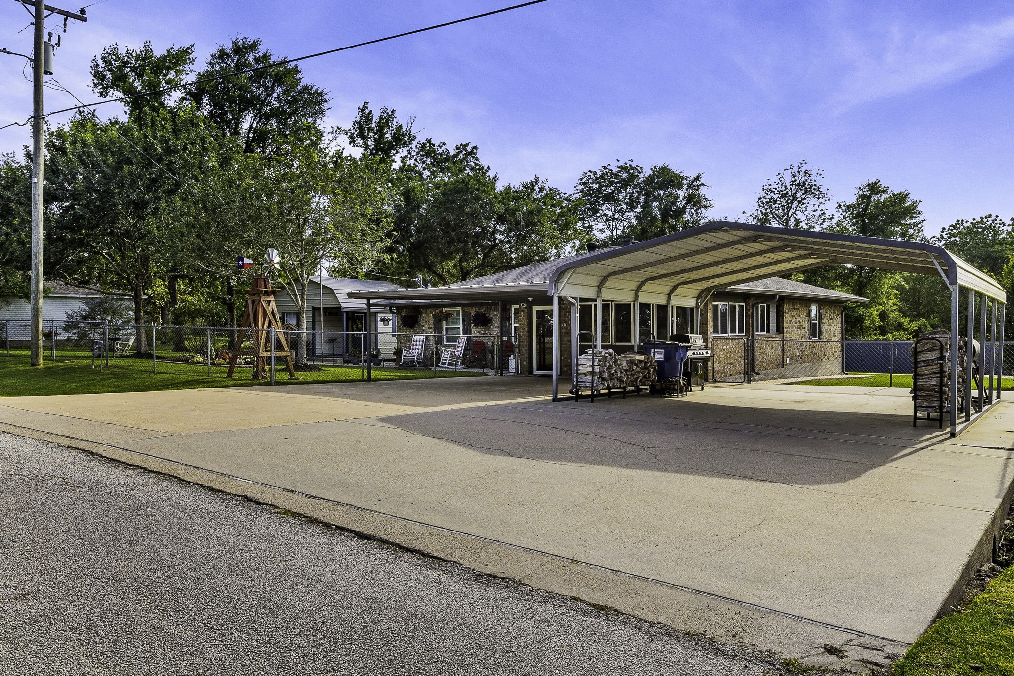 188 Huckleberry Road Onalaska, TX 77360 - Photo 4 of 49 a view of street with large trees