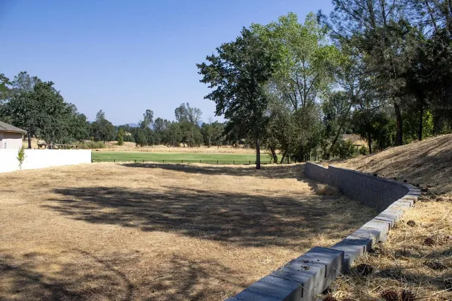 a view of a yard with an outdoor space