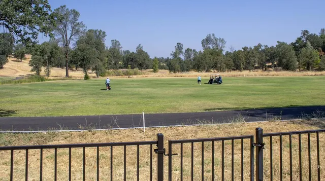 a view of a yard with a house