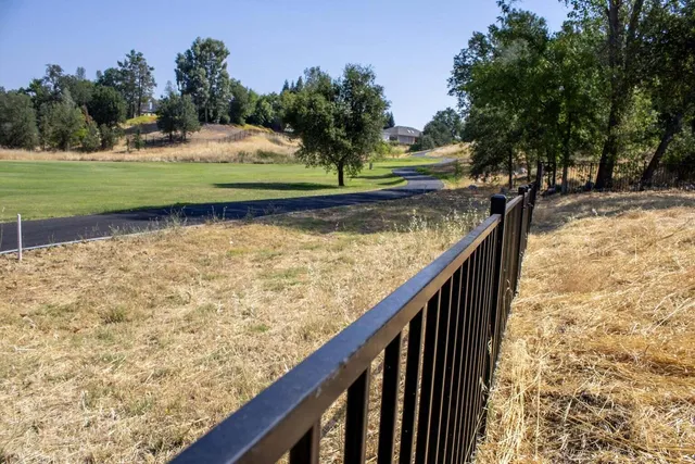a view of swimming pool from a balcony