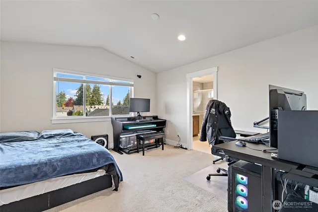 a bedroom with a bed and a desk