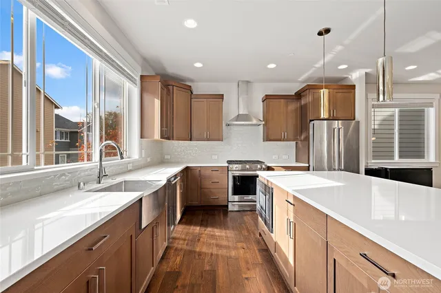 a kitchen with a sink stove and refrigerator