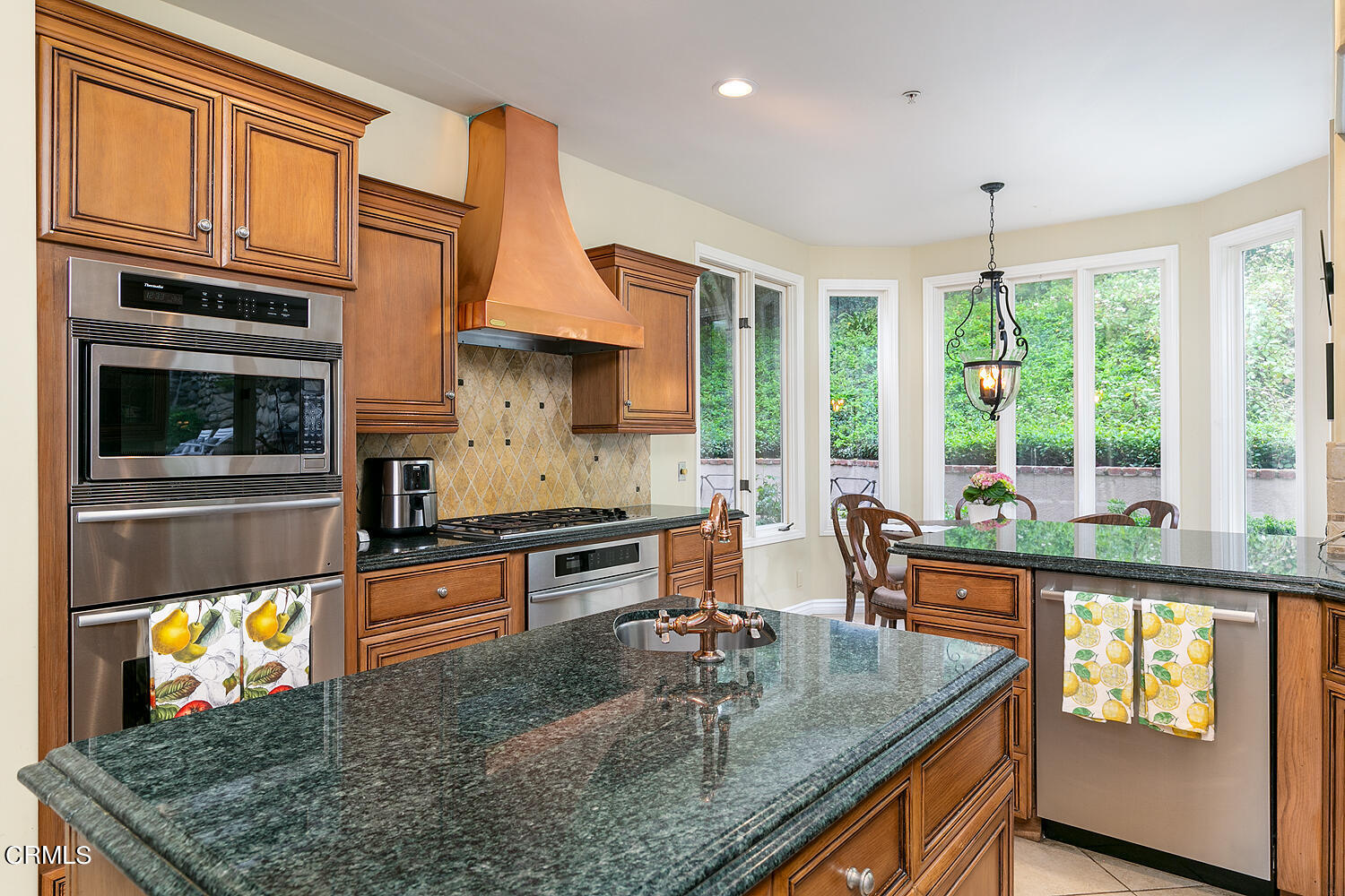 1429 Rutherford Drive Pasadena, CA 91103 - Photo 11 of 34 a kitchen with stainless steel appliances granite countertop a stove a sink and a microwave