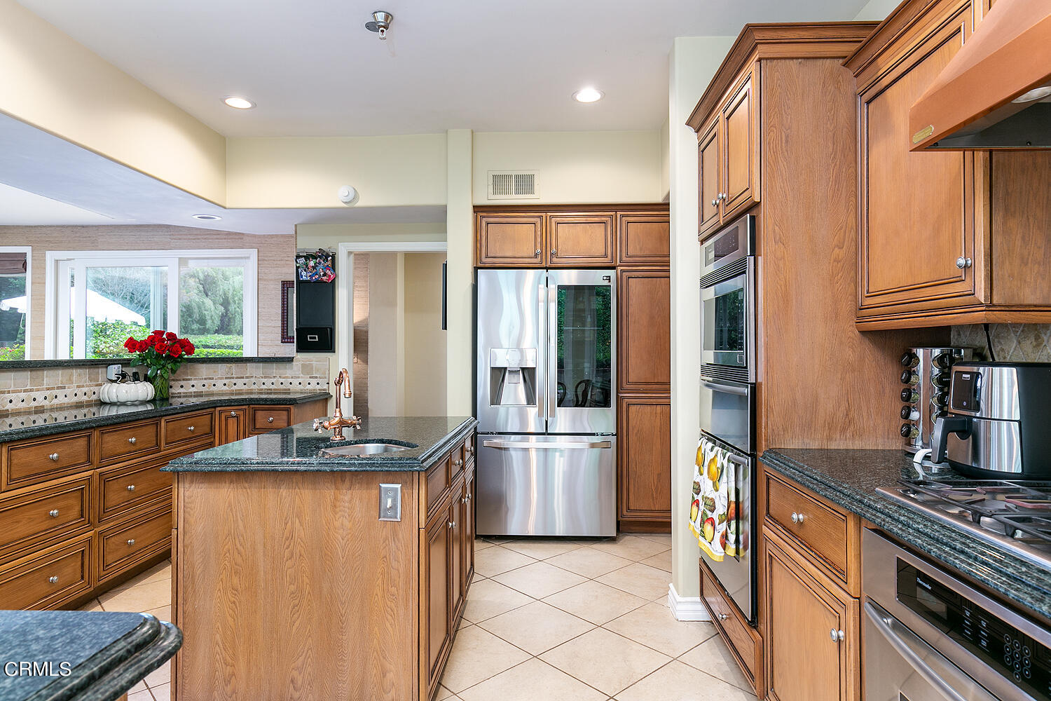 1429 Rutherford Drive Pasadena, CA 91103 - Photo 13 of 34 a kitchen with stainless steel appliances granite countertop a refrigerator a stove and a sink