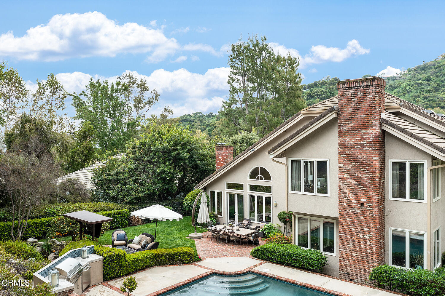 1429 Rutherford Drive Pasadena, CA 91103 - Photo 32 of 34 a view of a white house with a yard plants and large tree