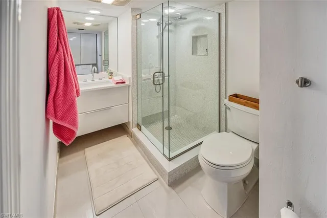 a bathroom with a shower and a toilet